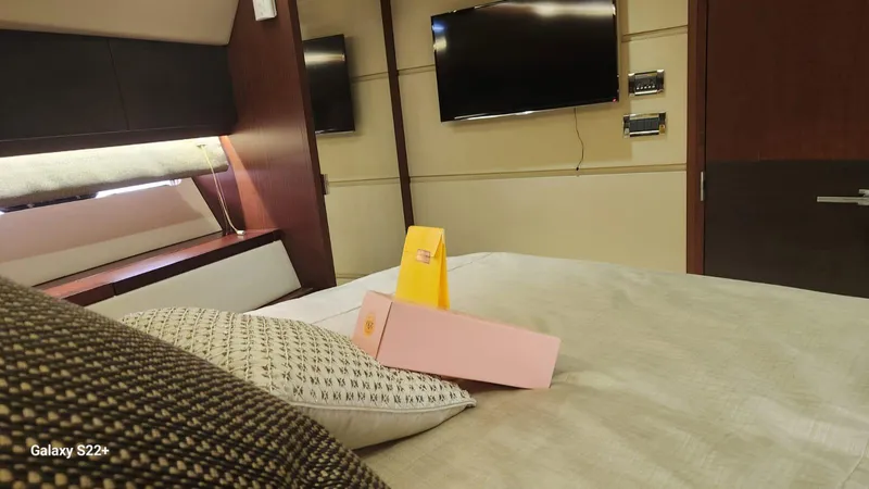 Zen Yacht Photos Pics Luxurious bedroom interior of 2015 Sea Ray L650 Fly yacht with modern decor.