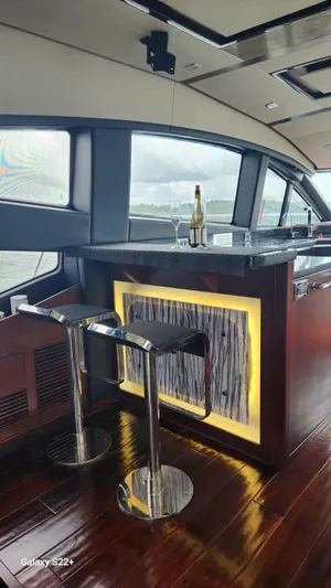 Zen Yacht Photos Pics Luxurious interior of 2015 Sea Ray L650 Fly yacht with modern bar area.