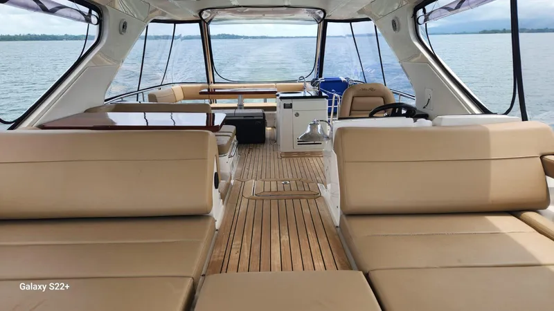 Zen Yacht Photos Pics Luxurious 2015 Sea Ray L650 Fly yacht interior with spacious seating and elegant wood flooring.