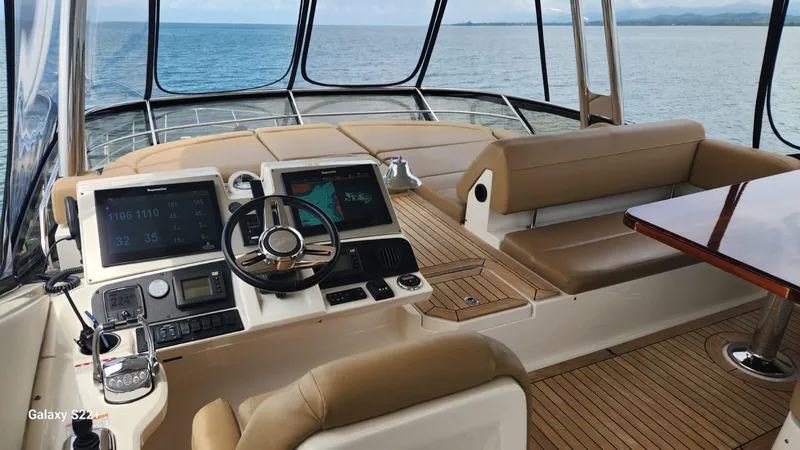 Zen Yacht Photos Pics Luxurious 2015 Sea Ray L650 Fly yacht cockpit with modern navigation systems and ocean view.