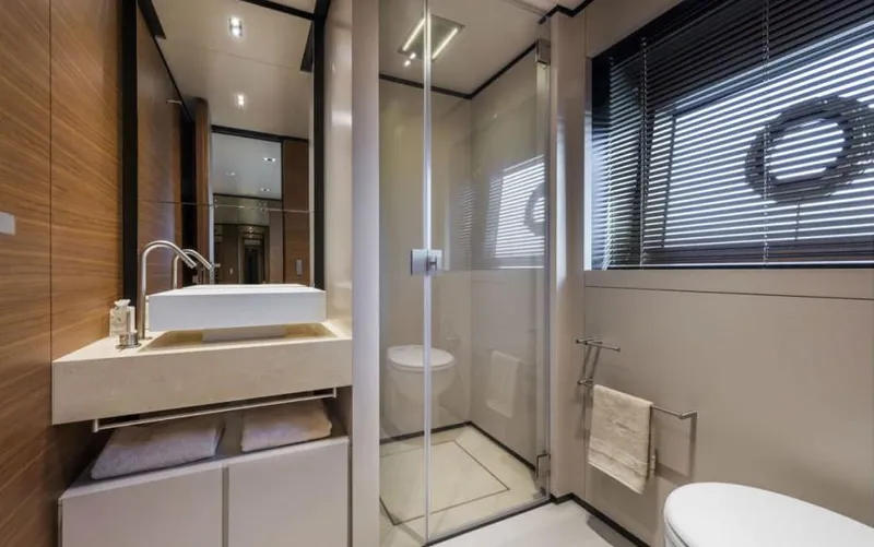  Yacht Photos Pics Luxurious bathroom in 2024 Custom Line Navetta 33 yacht with modern fixtures and elegant design.