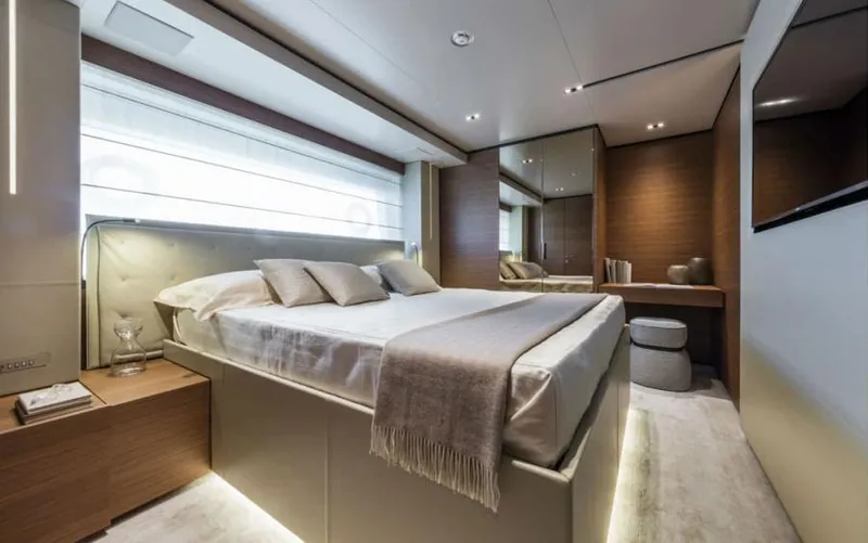  Yacht Photos Pics Luxurious bedroom interior on 2024 Custom Line Navetta 33 yacht, featuring modern design and elegant furnishings.