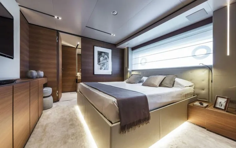  Yacht Photos Pics Luxurious bedroom interior of 2024 Custom Line Navetta 33 yacht, featuring modern design and elegant decor.