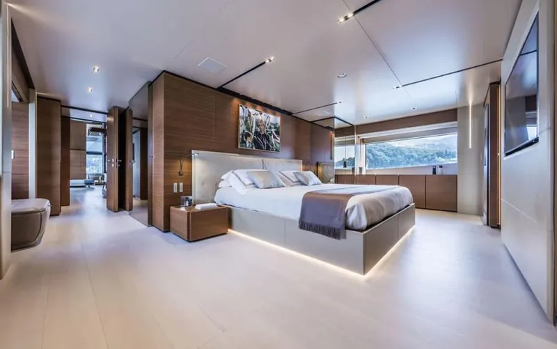  Yacht Photos Pics Luxurious bedroom interior of 2024 Custom Line Navetta 33 yacht, featuring modern design and elegant furnishings.