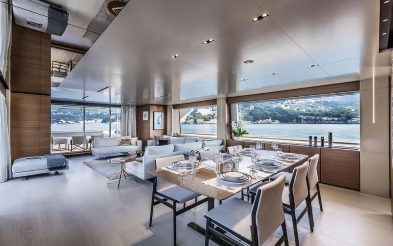  Yacht Photos Pics Luxurious interior of 2024 Custom Line Navetta 33 yacht with elegant dining and lounge area.