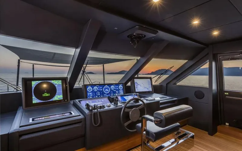  Yacht Photos Pics Helm of 2024 Custom Line Navetta 33 yacht at sunset, featuring advanced navigation systems.