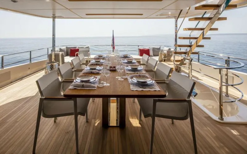  Yacht Photos Pics Luxurious dining area on 2024 Custom Line Navetta 33 yacht with ocean view.