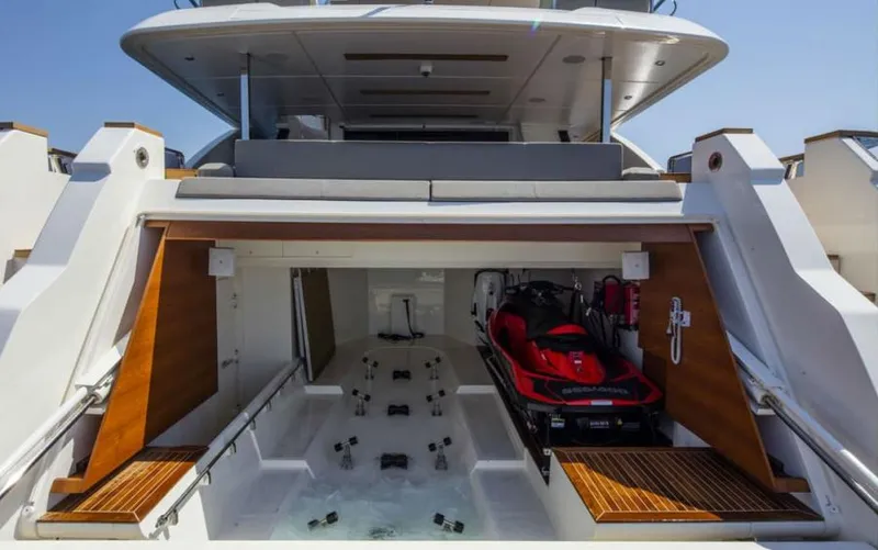  Yacht Photos Pics 2024 Custom Line Navetta 33 yacht with a jet ski in the garage.