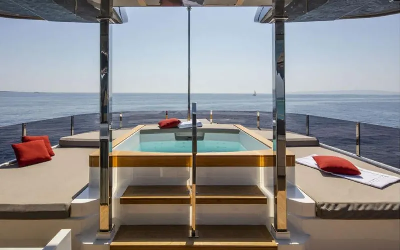  Yacht Photos Pics Luxurious 2024 Custom Line Navetta 33 yacht deck with pool and ocean view.