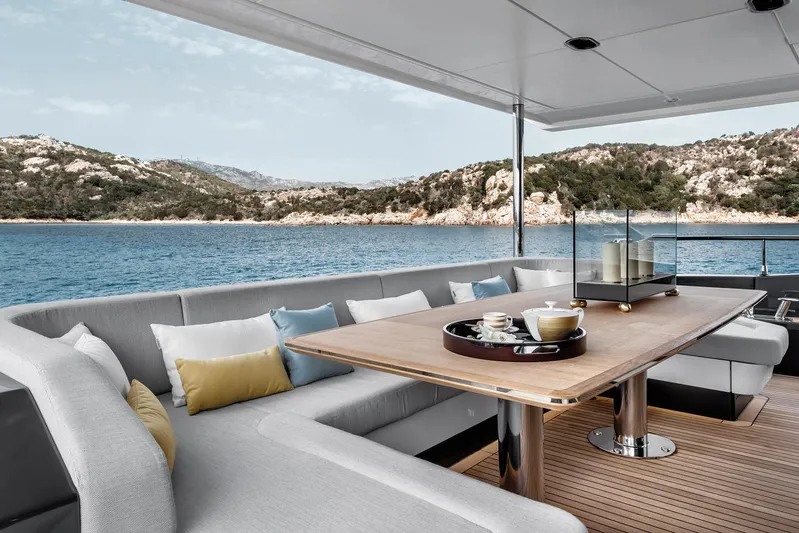  Yacht Photos Pics Luxurious 2025 Azimut Grande 27M yacht deck with elegant seating and scenic ocean view.