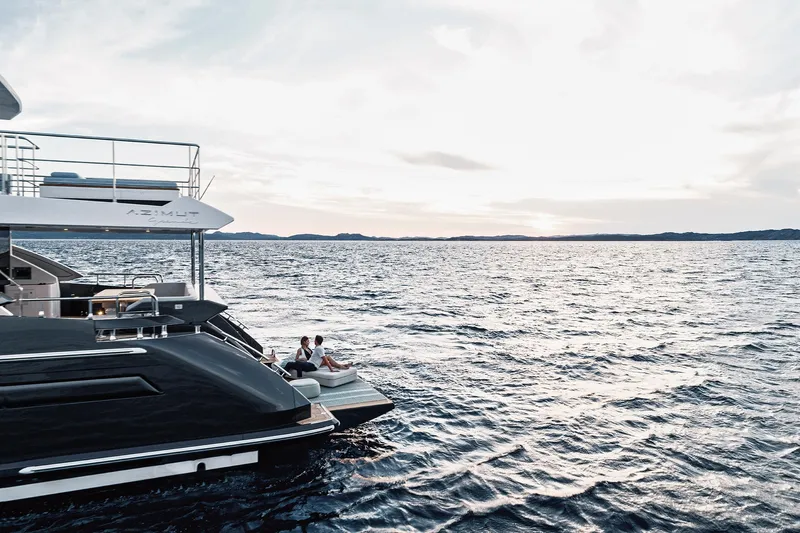  Yacht Photos Pics Luxury Azimut Grande 27M yacht on serene ocean, 2025 model.