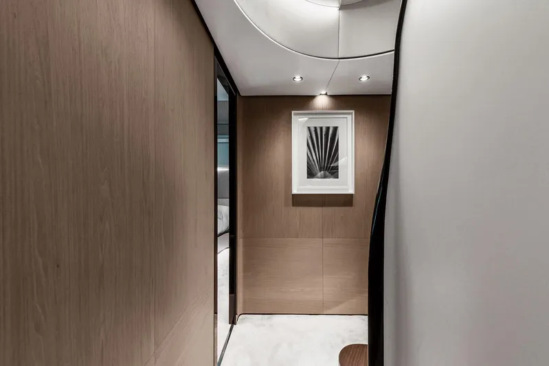  Yacht Photos Pics Luxurious interior hallway of 2025 Azimut Grande 27M yacht with modern artwork.