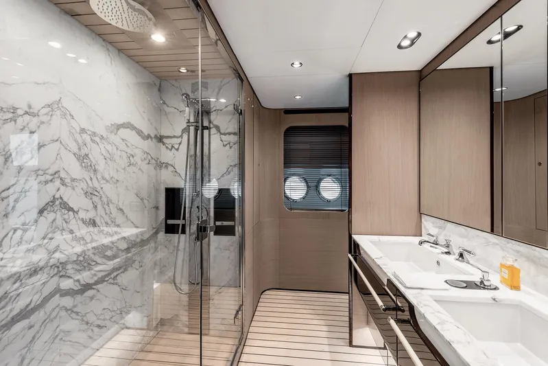  Yacht Photos Pics Luxurious bathroom in 2025 Azimut Grande 27M yacht with marble and modern fixtures.