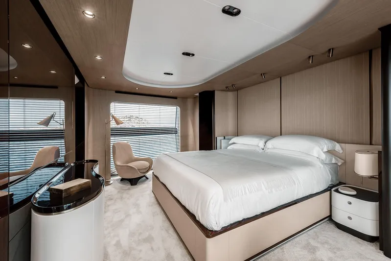  Yacht Photos Pics Luxurious bedroom interior of 2025 Azimut Grande 27M yacht with modern design and elegant furnishings.