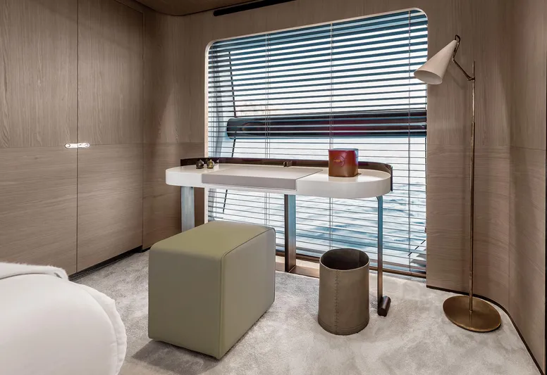  Yacht Photos Pics Luxurious interior of 2025 Azimut Grande 27M yacht with modern desk and seating.