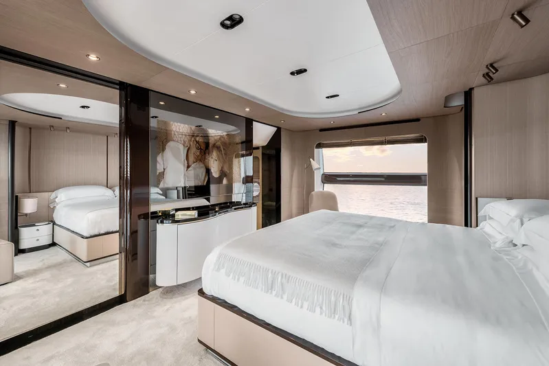  Yacht Photos Pics Luxurious bedroom interior of 2025 Azimut Grande 27M yacht with modern design and ocean view.