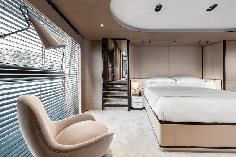  Yacht Photos Pics Luxurious bedroom interior of 2025 Azimut Grande 27M yacht with modern design and elegant furnishings.