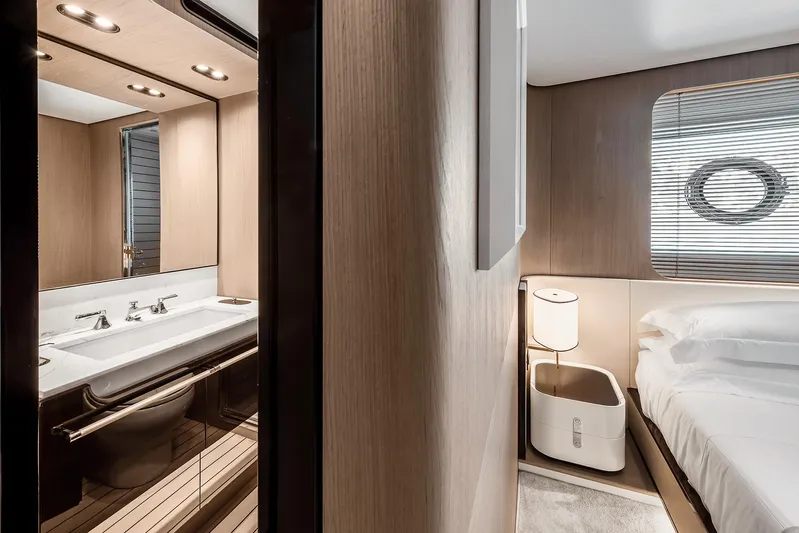  Yacht Photos Pics Luxurious interior of 2025 Azimut Grande 27M yacht, featuring modern bathroom and cozy bedroom.