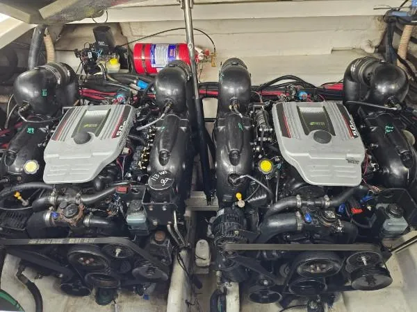  Yacht Photos Pics Twin engines of a 2013 Sea Ray 310 Sundancer boat, featuring a fire extinguisher.