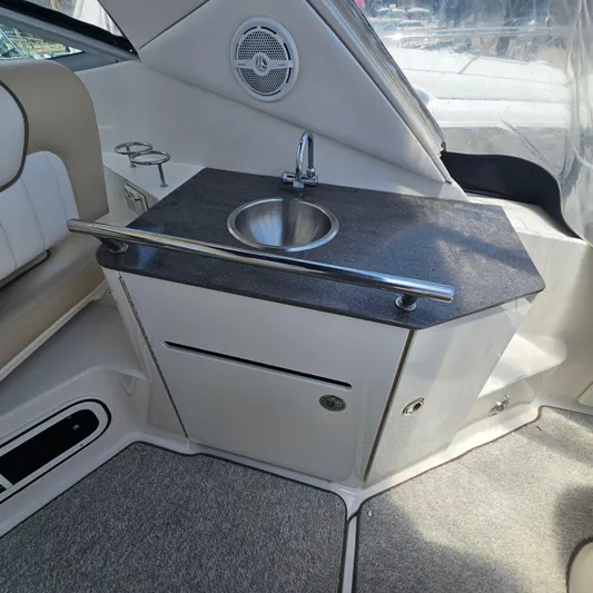  Yacht Photos Pics Interior of 2013 Sea Ray 310 Sundancer with sink and countertop.