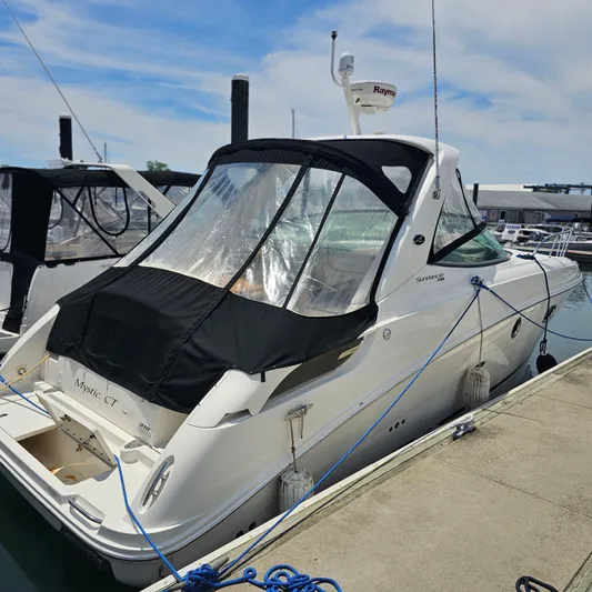  Yacht Photos Pics 2013 Sea Ray 310 Sundancer docked at marina with protective cover.