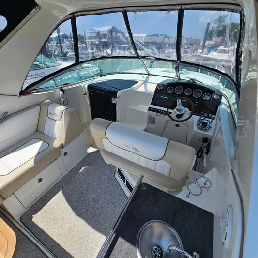  Yacht Photos Pics Interior of 2013 Sea Ray 310 Sundancer boat with helm and seating area.
