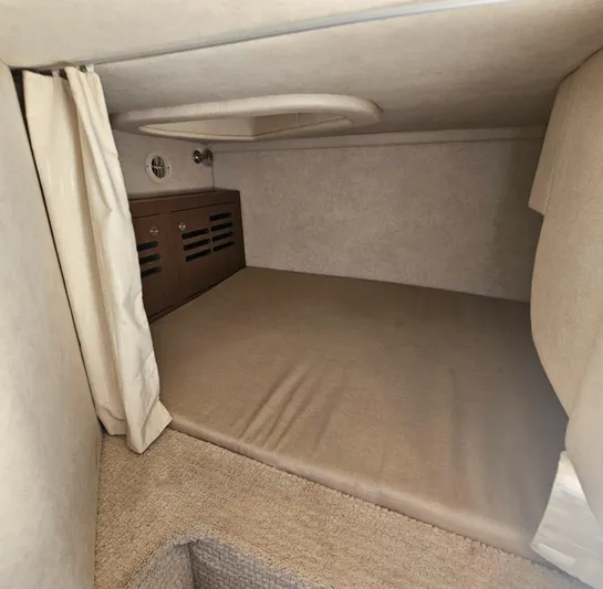  Yacht Photos Pics 2013 Sea Ray 310 Sundancer cabin interior with beige upholstery and storage compartments.