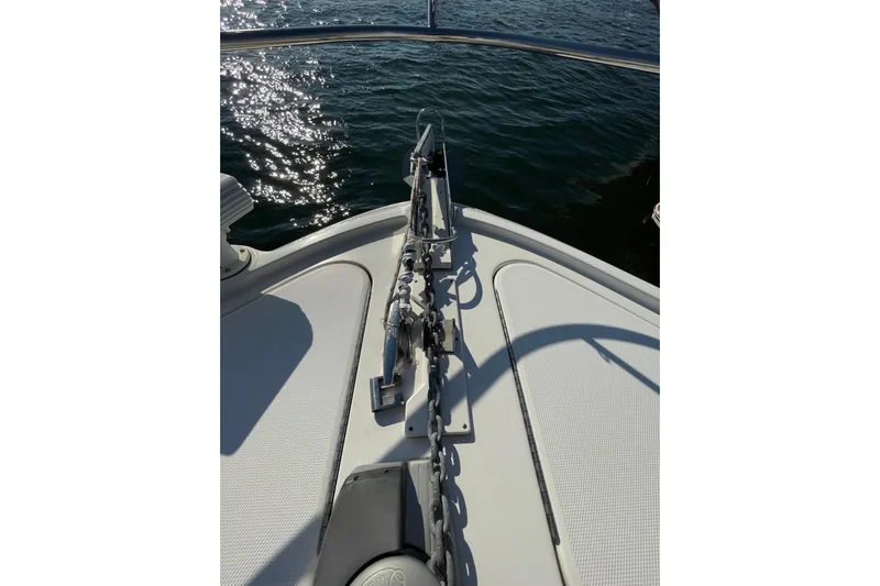  Yacht Photos Pics Bow of 2013 Sea Ray 510 Sundancer yacht with anchor chain, on water.