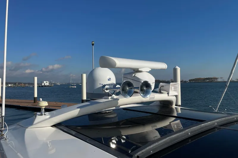  Yacht Photos Pics 2013 Sea Ray 510 Sundancer yacht with radar and antennas, docked by the water.