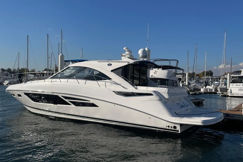  Yacht Photos Pics 2013 Sea Ray 510 Sundancer yacht docked in a marina under clear blue skies.