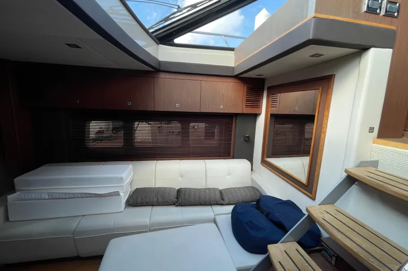  Yacht Photos Pics Luxurious interior of 2013 Sea Ray 510 Sundancer yacht with modern seating and skylight.