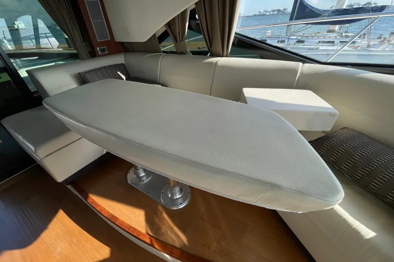  Yacht Photos Pics Luxurious interior of 2013 Sea Ray 510 Sundancer yacht with elegant seating and table.