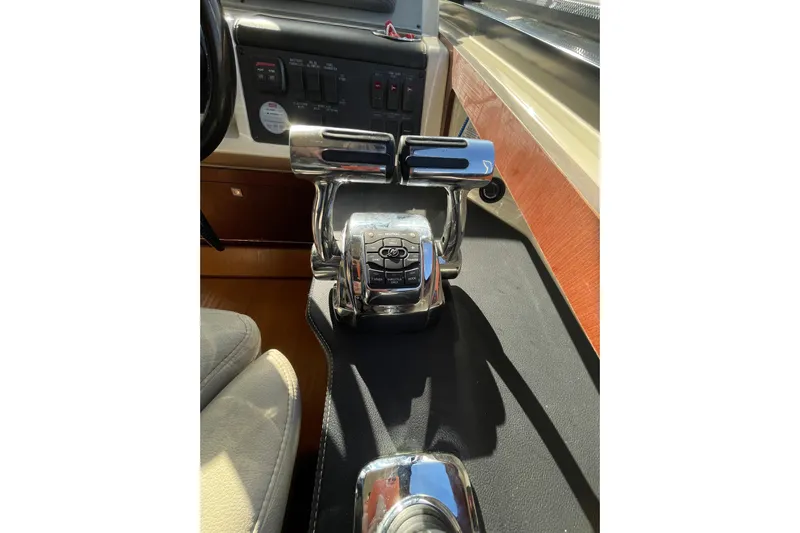  Yacht Photos Pics 2013 Sea Ray 510 Sundancer helm controls with polished chrome finish.