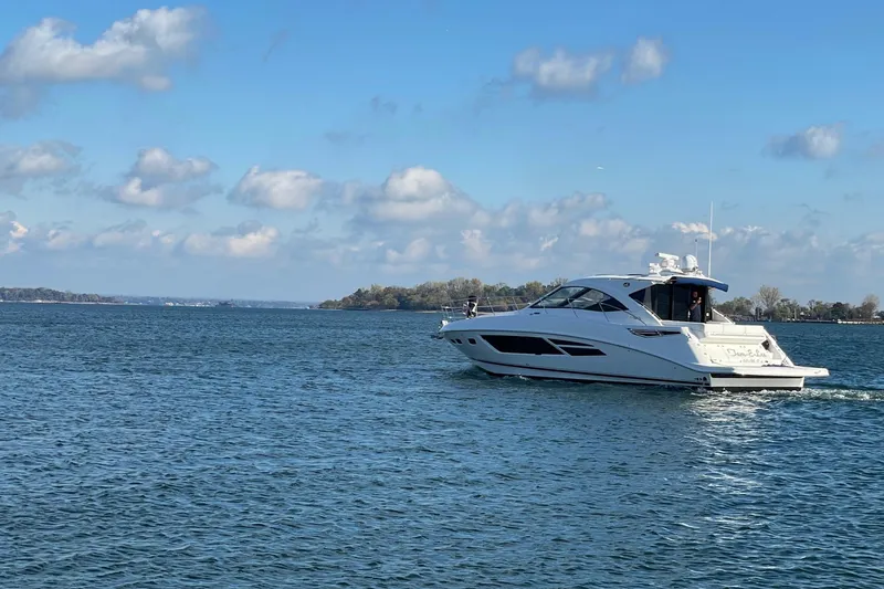  Yacht Photos Pics 2013 Sea Ray 510 Sundancer yacht cruising on a sunny day.