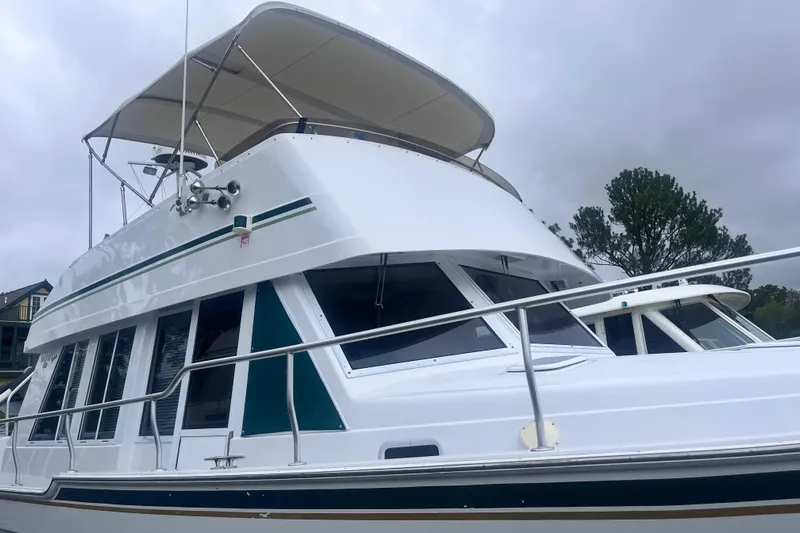  Yacht Photos Pics 2000 Mainship 43 Trawler Aft Cabin with white exterior and green accents.