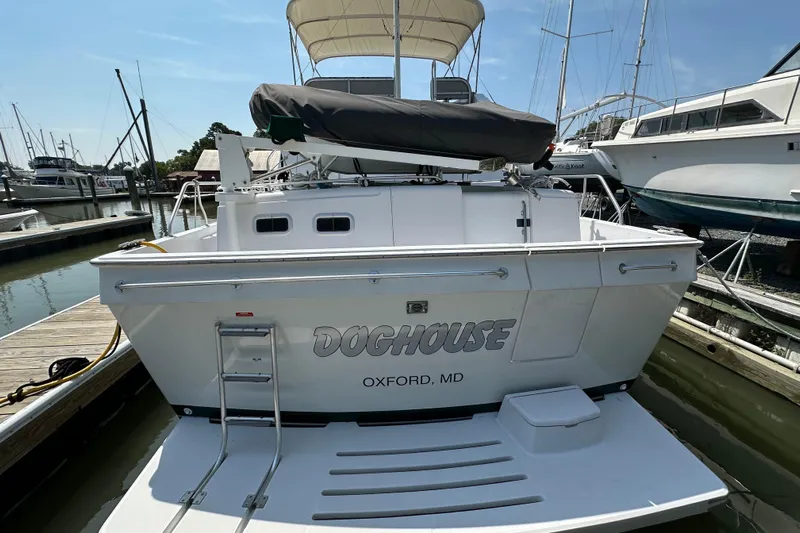  Yacht Photos Pics 2000 Mainship 43 Trawler Aft Cabin docked, featuring "Doghouse" name, Oxford, MD.