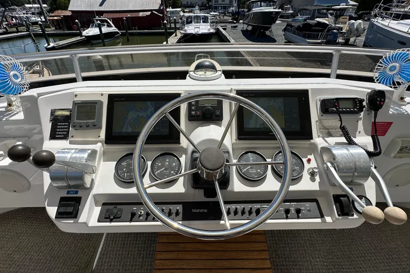  Yacht Photos Pics Helm of 2000 Mainship 43 Trawler Aft Cabin with navigation instruments and controls.