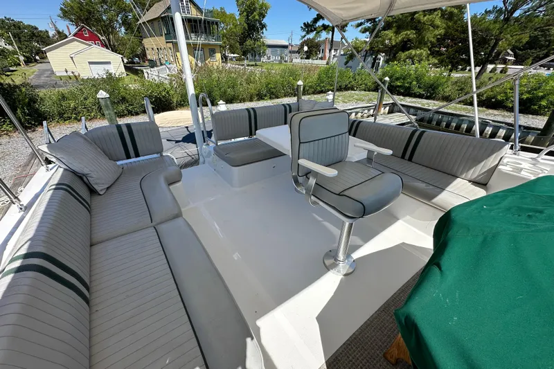  Yacht Photos Pics 2000 Mainship 43 Trawler Aft Cabin with spacious outdoor seating and helm chair.