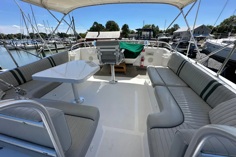  Yacht Photos Pics 2000 Mainship 43 Trawler Aft Cabin with spacious seating and table on deck.