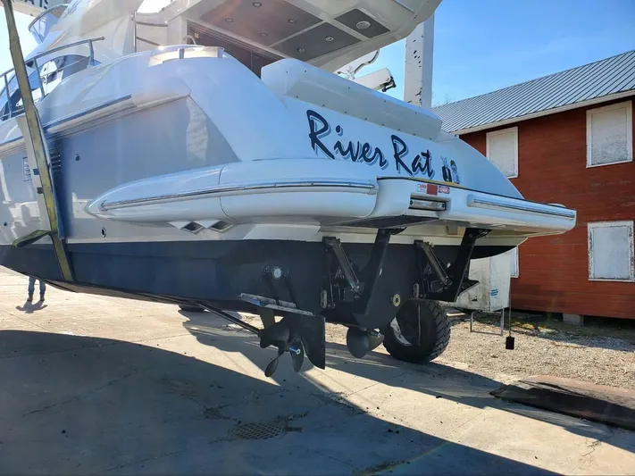 River Rat Yacht Photos Pics 2013 Azimut 45 Flybridge yacht on dry dock, rear view with propellers visible.