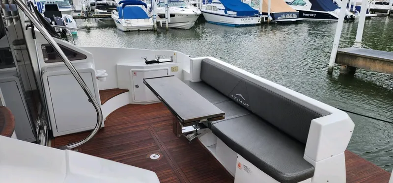 River Rat Yacht Photos Pics 2013 Azimut 45 Flybridge yacht with outdoor seating and table, docked at marina.