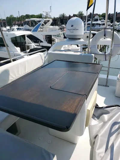 River Rat Yacht Photos Pics 2013 Azimut 45 Flybridge yacht with sleek deck and modern amenities in marina setting.
