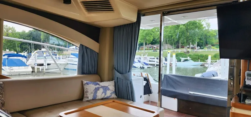 River Rat Yacht Photos Pics Interior view of 2013 Azimut 45 Flybridge yacht, overlooking marina with boats.