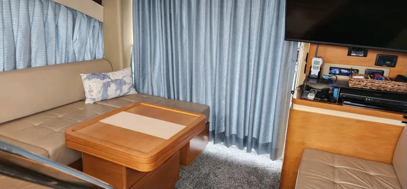 River Rat Yacht Photos Pics Interior of 2013 Azimut 45 Flybridge yacht with seating, table, and entertainment area.