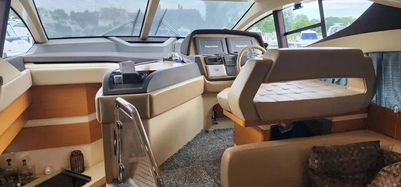 River Rat Yacht Photos Pics Interior of a 2013 Azimut 45 Flybridge yacht, featuring a modern helm and seating area.
