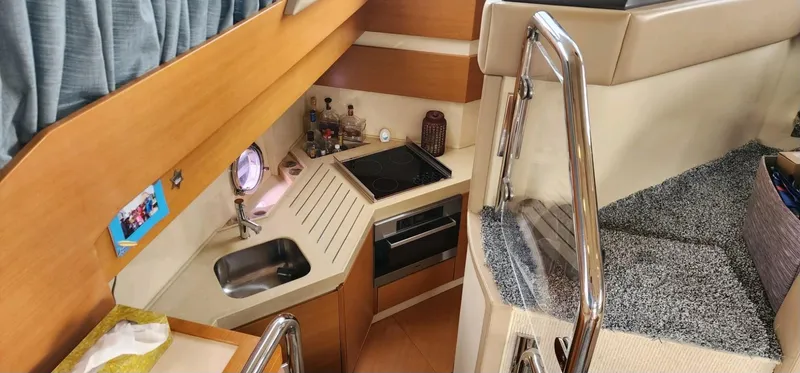 River Rat Yacht Photos Pics Interior of 2013 Azimut 45 Flybridge yacht with compact kitchen and stairs.