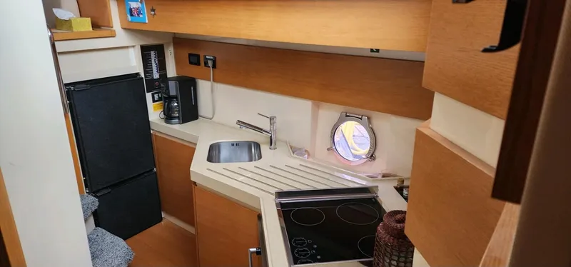 River Rat Yacht Photos Pics Compact kitchen in 2013 Azimut 45 Flybridge yacht with modern amenities and sleek design.