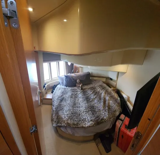 River Rat Yacht Photos Pics Cozy bedroom in 2013 Azimut 45 Flybridge yacht with plush bedding and natural light.