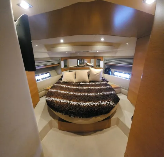 River Rat Yacht Photos Pics Luxurious bedroom interior of 2013 Azimut 45 Flybridge yacht with plush bedding.