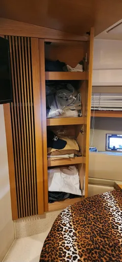 River Rat Yacht Photos Pics Wooden closet with shelves in 2013 Azimut 45 Flybridge yacht bedroom.